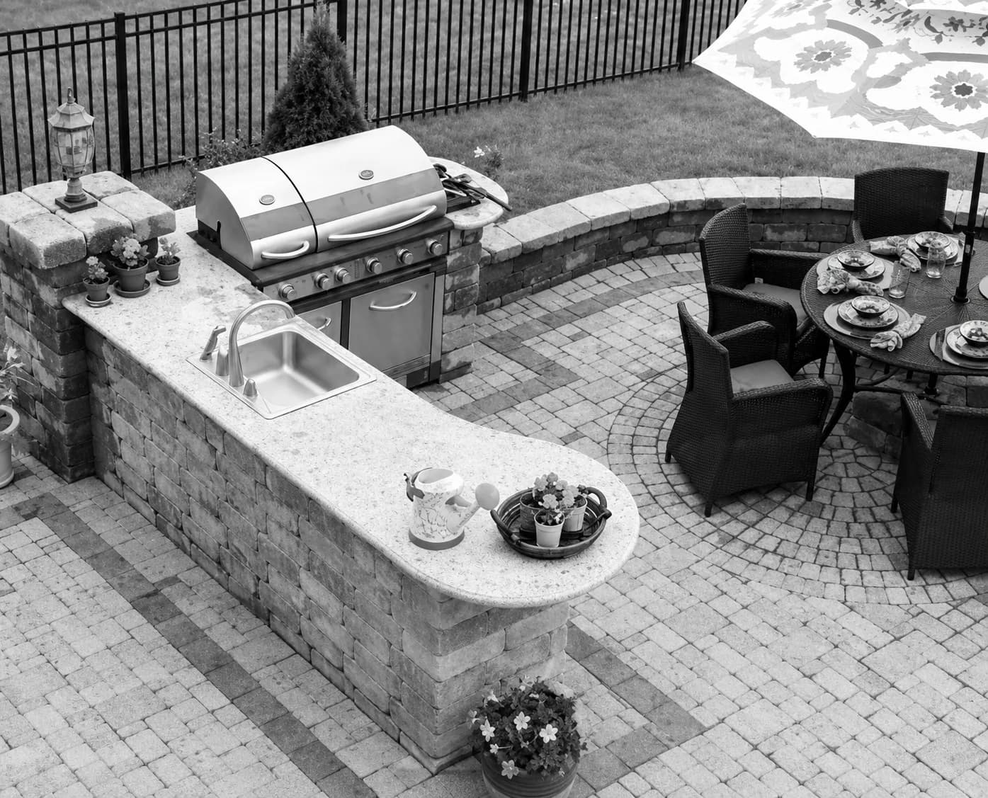 High-end outdoor kitchen and paver patio built by the contractor