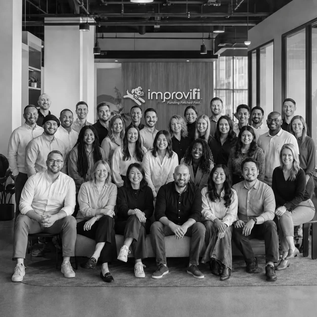 The Improvifi team gathered together at the office